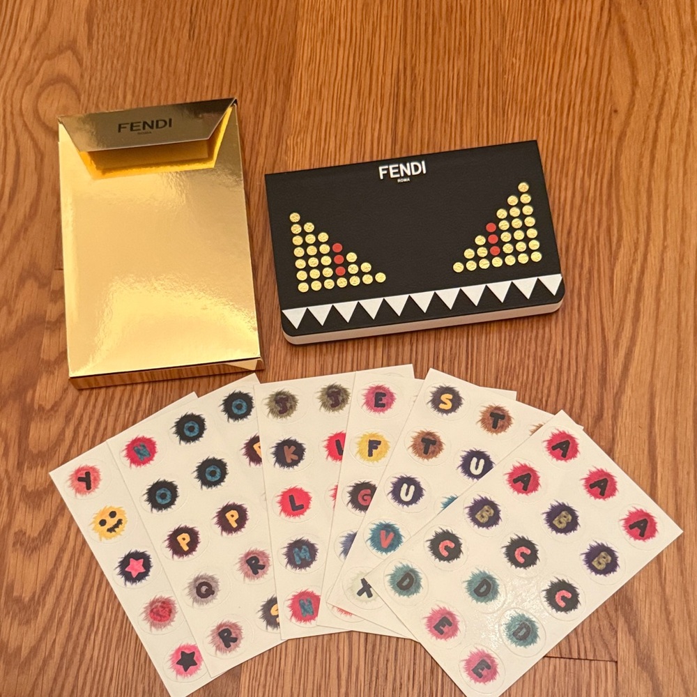 Fendi notebook with set of stickers.